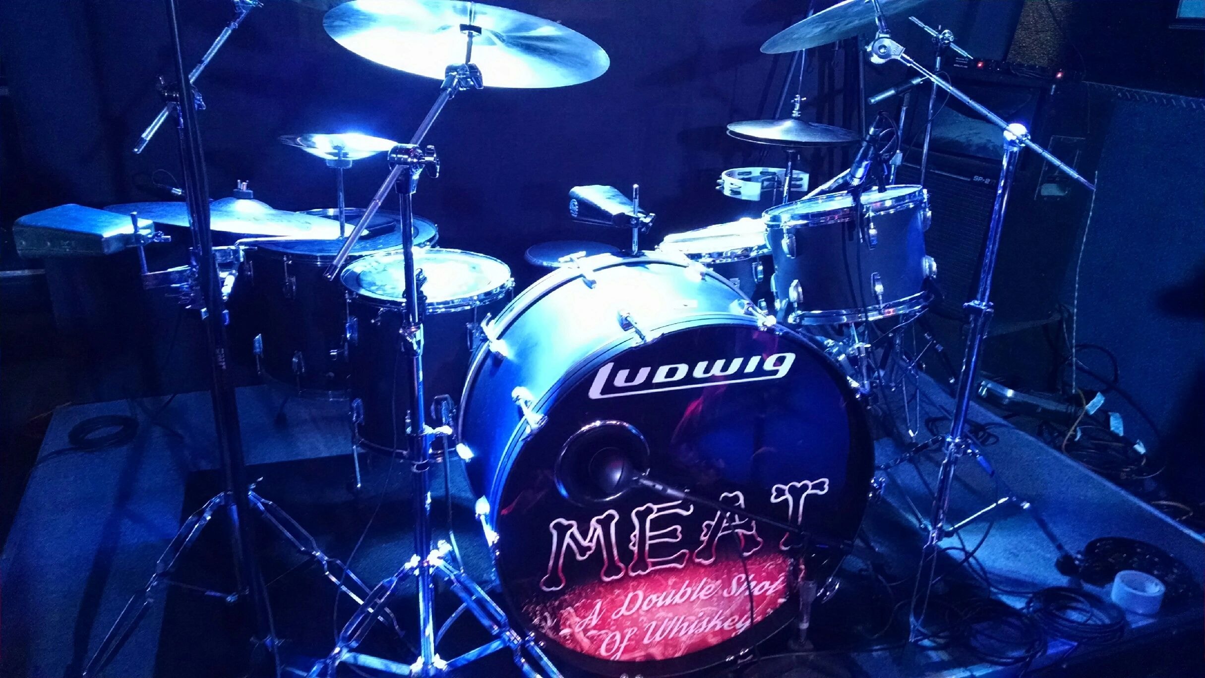 MEAT drum kit — Ludwig vintage drums under blue stage lighting